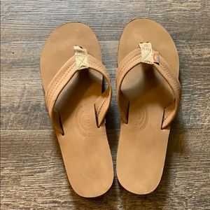 Light tan rainbow flip flops